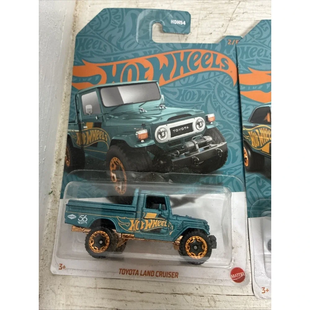 Two HOT WHEELS '65 Mercury Comet Cyclone And Toyota Land Cruiser NIP